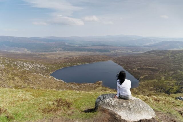 My niece taking a rest in front of the lake Ouler